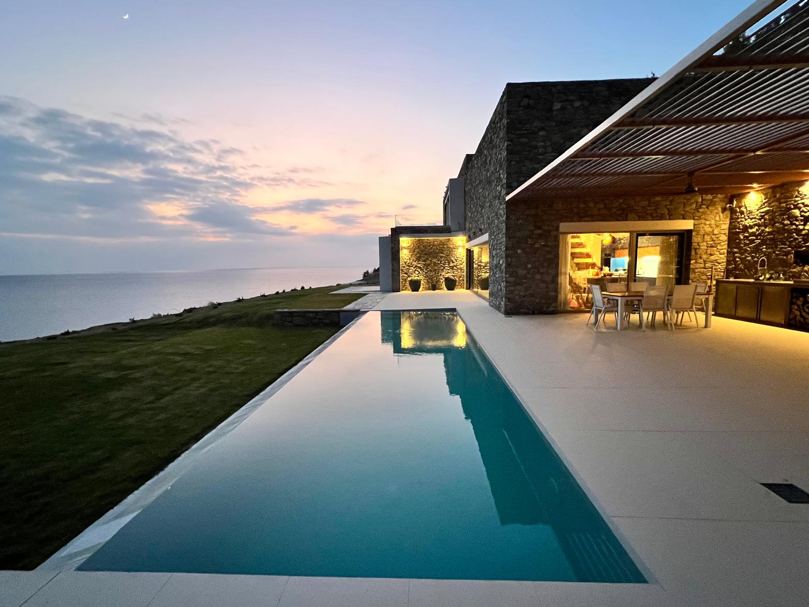 Sunset Cliff Villa at sunset — seafront residence in Lesvos