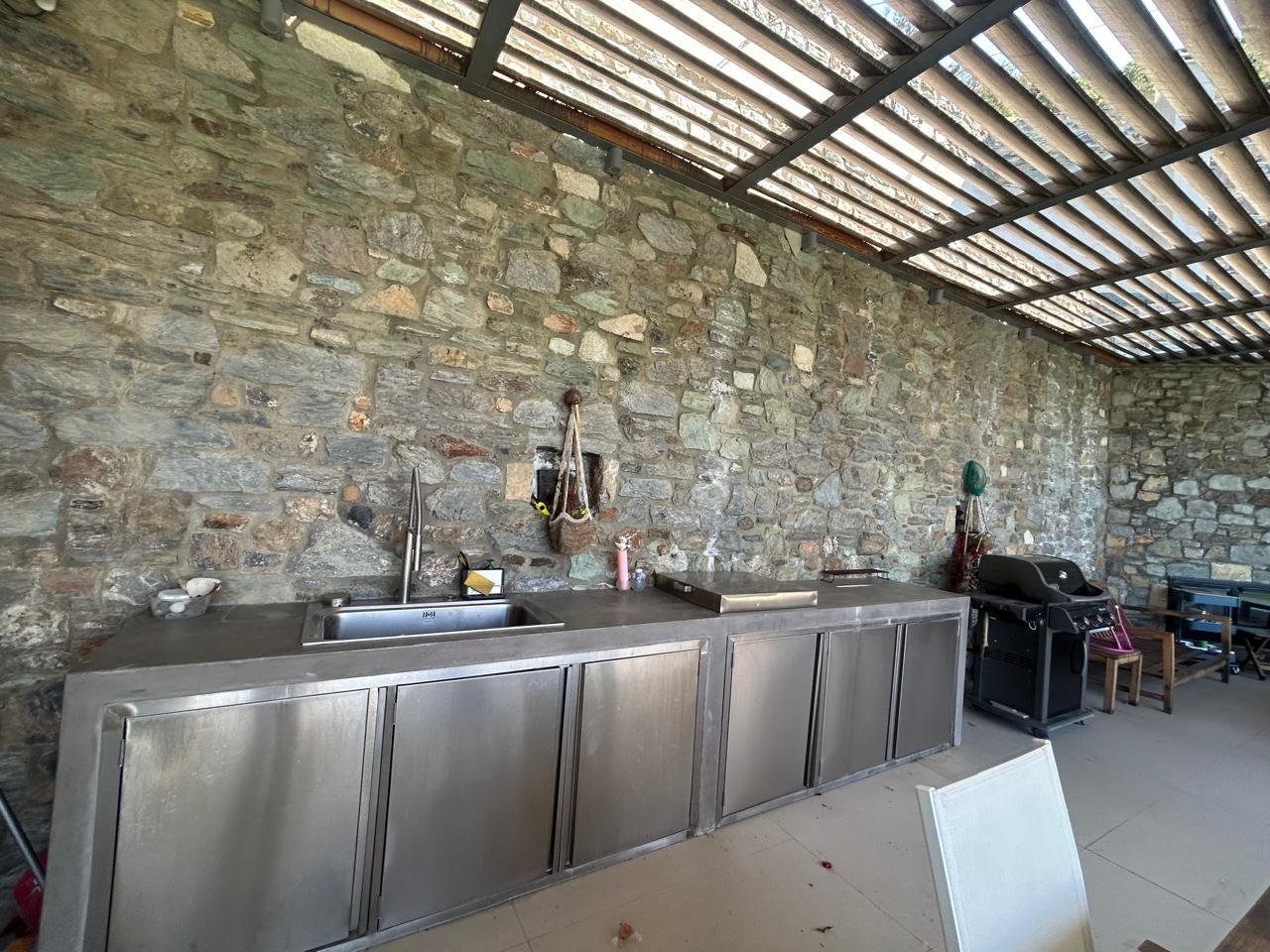 Stainless-steel outdoor kitchen with gas grill