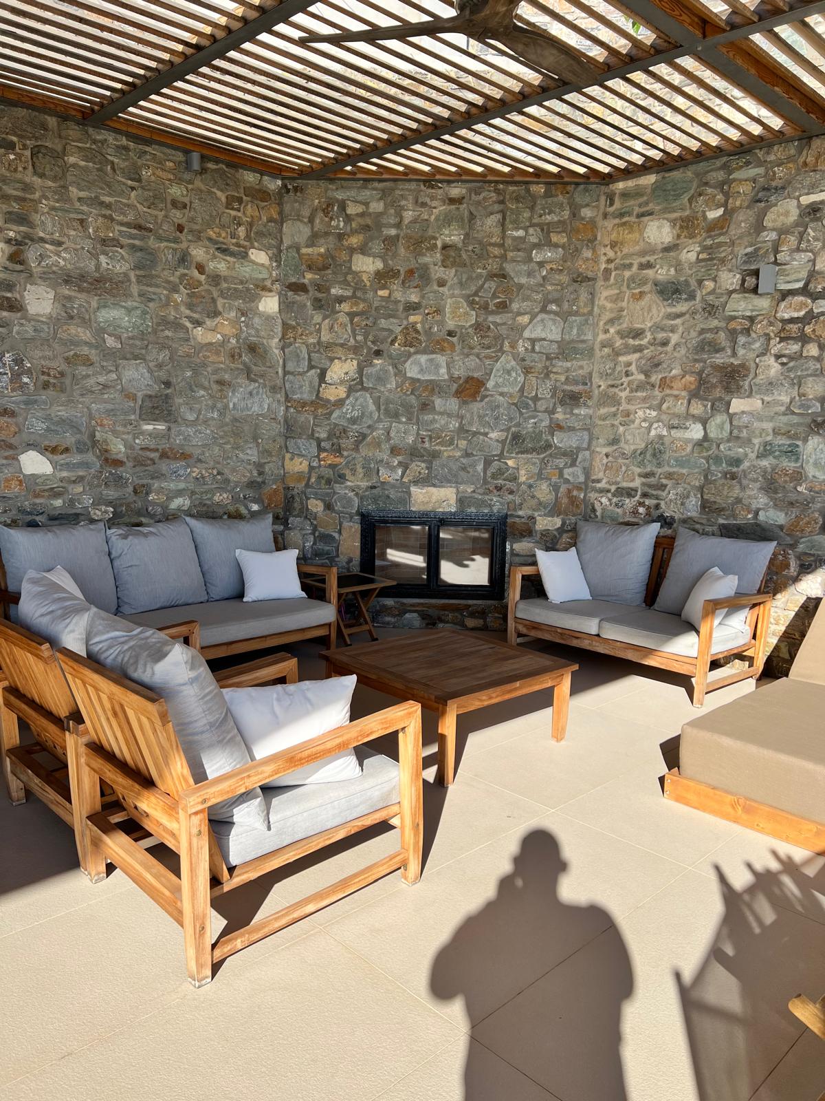 Stone fireplace and pergola lounge