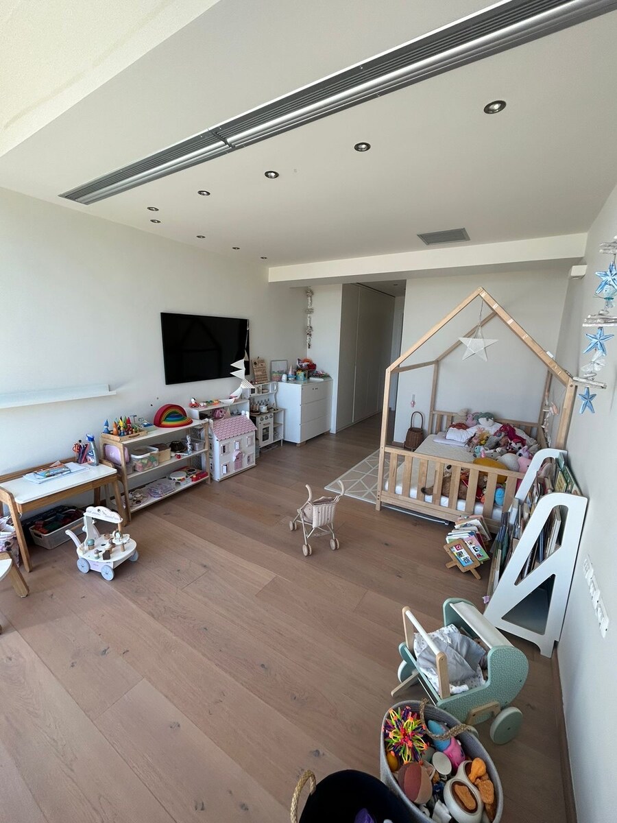 Currently the child’s room — house-bed, toys, full sea view through floor-to-ceiling glass